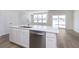 Contemporary kitchen with a large island, stainless steel dishwasher, and open layout at 10965 Morab Dr, Zionsville, IN 46077