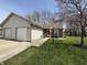 Charming single-story home with a well-maintained lawn, attached garage, and inviting entrance at 111 Woodberry Dr, Danville, IN 46122