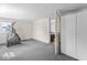 Bedroom with gray carpet, workout equipment and doorway to the living area at 1126 N Anderson St, Elwood, IN 46036