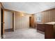 Bedroom features carpeted floors, wooden furniture, and access to adjoining rooms at 1126 N Anderson St, Elwood, IN 46036