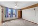 Bedroom with colorful curtains, ceiling fan and carpet at 1126 N Anderson St, Elwood, IN 46036