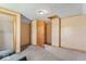 A simple bedroom with a closet and doorway, with neutral gray carpeting at 1126 N Anderson St, Elwood, IN 46036