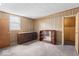 Bedroom features carpeted floors, wooden furniture, and access to adjoining rooms at 1126 N Anderson St, Elwood, IN 46036