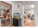 View of the hall has an aquarium, laminate wood flooring, and access to other rooms at 1126 N Anderson St, Elwood, IN 46036