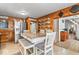 Spacious eat-in kitchen featuring stainless steel appliances and wood paneled walls at 1126 N Anderson St, Elwood, IN 46036