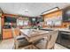 Eat-in kitchen featuring wood-paneled walls, shelving, and modern appliances at 1126 N Anderson St, Elwood, IN 46036