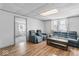 Large living room with wood floor, sofa set and doorway to another room at 1126 N Anderson St, Elwood, IN 46036