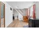 Cozy living room with wooden steps and view into the hallway at 1126 N Anderson St, Elwood, IN 46036