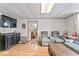 Bright living space featuring laminate flooring and open access to other rooms at 1126 N Anderson St, Elwood, IN 46036