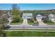An aerial view showcases a home with blue shutters and a well-manicured lawn in a neighborhood setting at 12258 Weathered Edge Dr, Fishers, IN 46037