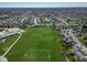 Aerial shot shows a neighborhood with a park, school, and mature trees at 12258 Weathered Edge Dr, Fishers, IN 46037