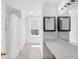 Bright bathroom featuring a bathtub, shower, and vanity with mirrors at 12258 Weathered Edge Dr, Fishers, IN 46037