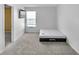 This bedroom is bright with carpet, a bed, and natural light at 12258 Weathered Edge Dr, Fishers, IN 46037