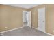 Neutral bedroom featuring two white doors and light-colored walls over carpet floors at 12258 Weathered Edge Dr, Fishers, IN 46037