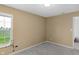 Bedroom featuring a large window with blinds and light-colored walls over carpet floors at 12258 Weathered Edge Dr, Fishers, IN 46037