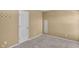 Neutral bedroom with a door and coat rack against beige walls over carpet floors at 12258 Weathered Edge Dr, Fishers, IN 46037