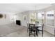 Bright dining area with natural light, modern table set, and laminate flooring at 12258 Weathered Edge Dr, Fishers, IN 46037