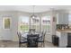 Cozy dining area bathed in natural light, next to the kitchen, with view of outdoor space at 12258 Weathered Edge Dr, Fishers, IN 46037