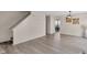 Living room with hardwood floors leading to an open layout with lots of natural light at 12258 Weathered Edge Dr, Fishers, IN 46037