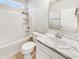 The clean, well-maintained bathroom features a combined tub and shower, toilet, and vanity sink with storage at 12521 Hawks Landing Dr, Fishers, IN 46037