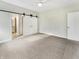 Neutral bedroom with sliding closet doors at 12521 Hawks Landing Dr, Fishers, IN 46037