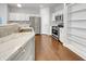 Modern kitchen with stainless appliances, granite countertops, and white cabinetry at 12521 Hawks Landing Dr, Fishers, IN 46037