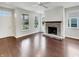 Bright living room with stone fireplace, hardwood floors, and recessed lighting at 12521 Hawks Landing Dr, Fishers, IN 46037