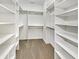 Spacious walk-in closet with ample shelving and hanging space for organized storage of clothes and accessories at 12521 Hawks Landing Dr, Fishers, IN 46037