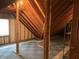 Attic with a window and wood beams at 1304 Park Meadow Dr, Beech Grove, IN 46107