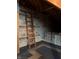 This is an attic space with paneling and a ladder at 1304 Park Meadow Dr, Beech Grove, IN 46107