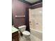 Bathroom with toilet, shower and plaid shower curtain at 1304 Park Meadow Dr, Beech Grove, IN 46107