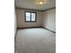 Bedroom featuring a window and carpet at 1304 Park Meadow Dr, Beech Grove, IN 46107