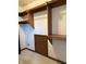 Walk-in closet featuring wood shelving and a door at 1304 Park Meadow Dr, Beech Grove, IN 46107