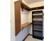 Walk-in closet featuring wood shelving and black shelving unit at 1304 Park Meadow Dr, Beech Grove, IN 46107