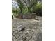 Stone entrance to Park Meadow featuring a manicured landscape and natural stone details at 1304 Park Meadow Dr, Beech Grove, IN 46107