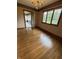 Traditional dining room featuring hardwood floors, wallpaper, and a chandelier at 1304 Park Meadow Dr, Beech Grove, IN 46107