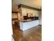 Open concept kitchen with an island, desk area, and bright lighting at 1304 Park Meadow Dr, Beech Grove, IN 46107