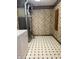 Practical laundry room with patterned floor, floral wallpaper and essential appliances at 1304 Park Meadow Dr, Beech Grove, IN 46107