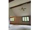 Living room featuring vaulted ceilings, large windows, and a ceiling fan at 1304 Park Meadow Dr, Beech Grove, IN 46107