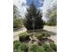 Street view with signage and landscaping at the entrance of the neighborhood at 1304 Park Meadow Dr, Beech Grove, IN 46107