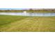 Beautiful backyard view of the lake and fountain, perfect for relaxation at 1416 Gleneagle Dr, Indianapolis, IN 46239