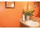 Bathroom features a plant, orange walls and is well-lit at 1416 Gleneagle Dr, Indianapolis, IN 46239