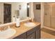 This bathroom is equipped with double sinks, a large mirror, and a shower at 1416 Gleneagle Dr, Indianapolis, IN 46239