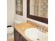 This half bath features a single vanity with neutral countertops and fixtures at 1416 Gleneagle Dr, Indianapolis, IN 46239