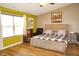 Bedroom features an abundance of natural light, hardwood floors, and neutral walls at 1416 Gleneagle Dr, Indianapolis, IN 46239