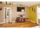 This bedroom features a vaulted ceiling with a TV, wood floors, and stylish decor at 1416 Gleneagle Dr, Indianapolis, IN 46239