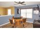 Bonus room with games table, ceiling fan, wall art, and mounted flat screen TV at 1416 Gleneagle Dr, Indianapolis, IN 46239