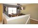 Bonus room with games table, ceiling fan, wall art, and mounted flat screen TV at 1416 Gleneagle Dr, Indianapolis, IN 46239