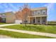 Charming two-story home featuring a manicured front yard and inviting entrance at 1416 Gleneagle Dr, Indianapolis, IN 46239