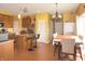 Bright kitchen with a center island, stainless steel appliances, and an adjacent dining area at 1416 Gleneagle Dr, Indianapolis, IN 46239